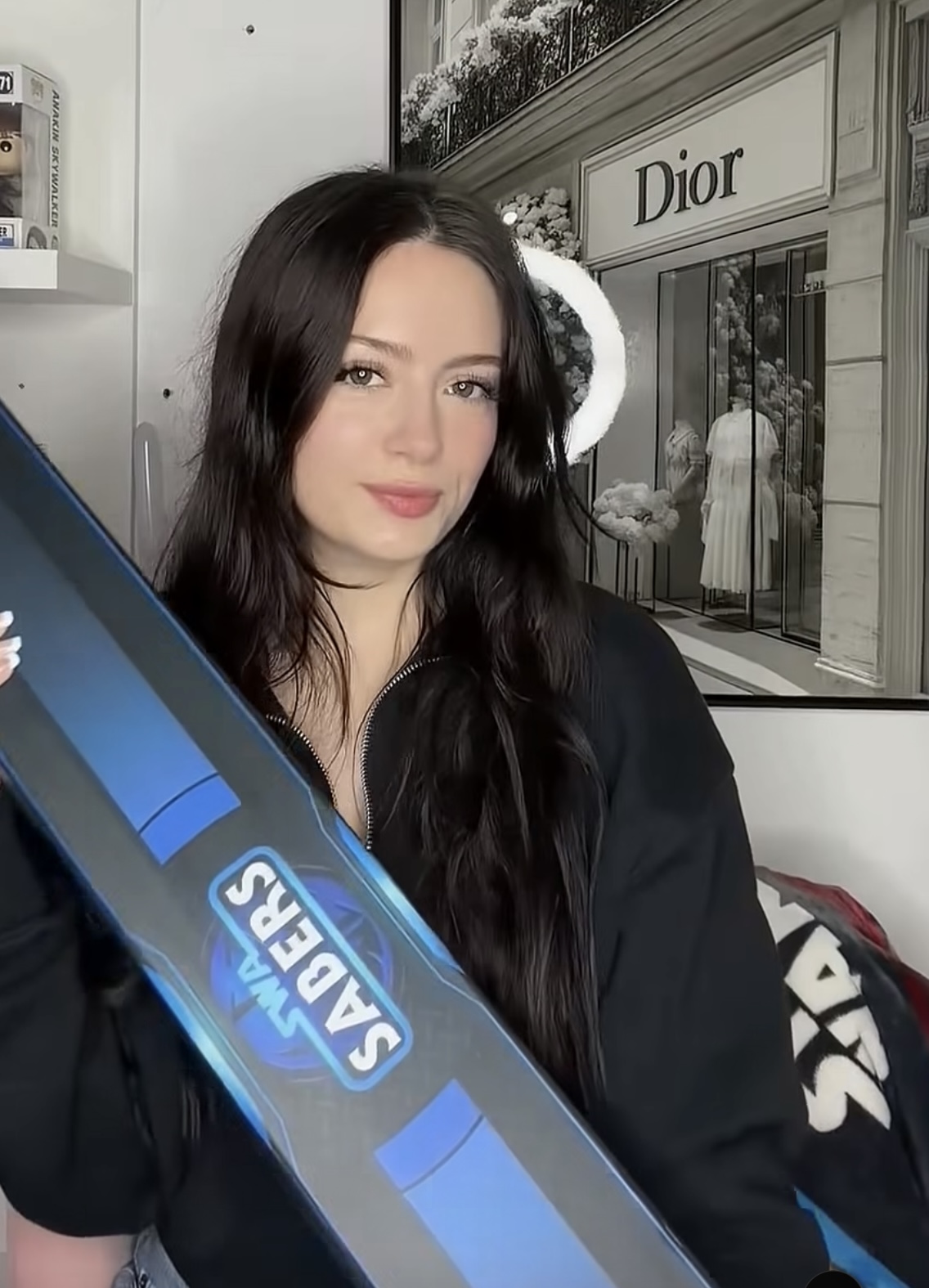 Adult woman creator presenting an SWA Sabers package