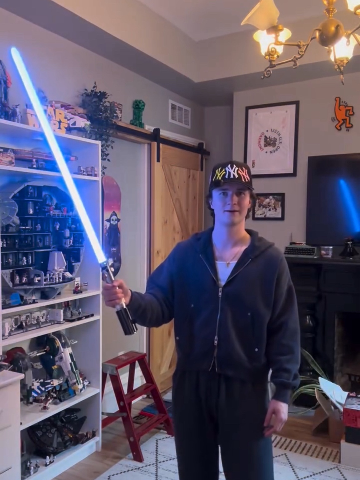 Original SWA creator demonstrating a blue illuminated saber