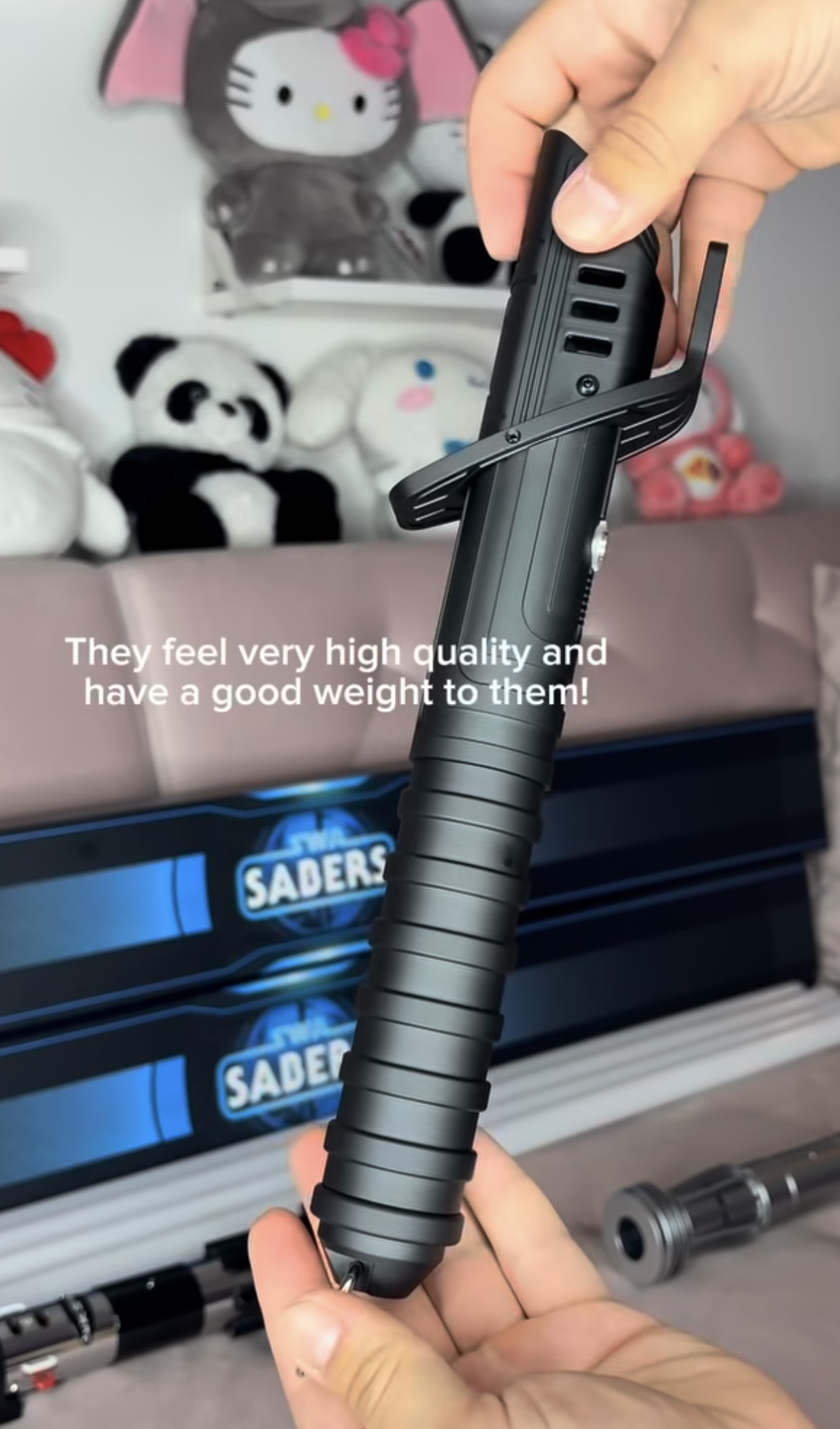Close-up adult creator demonstration of an SWA saber hilt